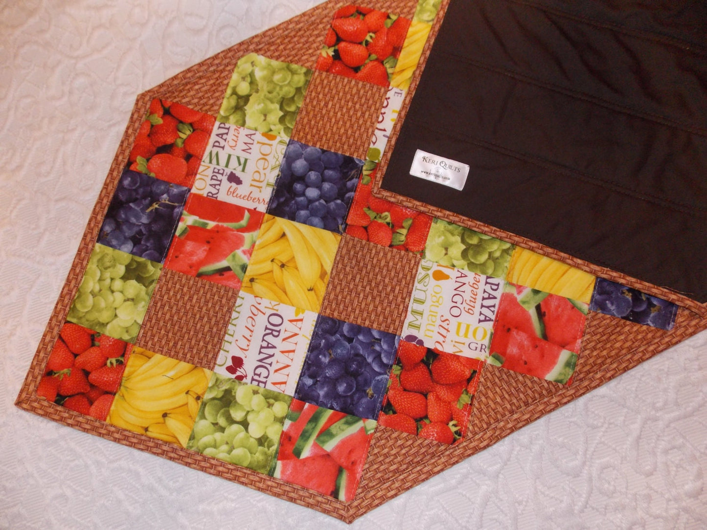 Table Runner Quilt, Table Topper Centerpiece, Fruit Quilt, Grape, Strawberry, Blueberry, Banana, Watermelon, brown, tan, red, green, yellow.