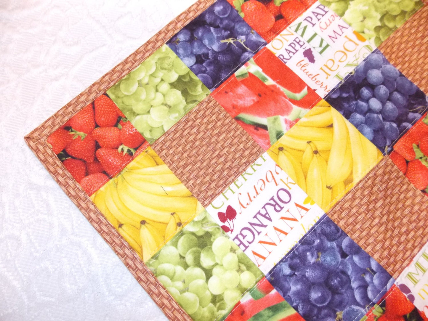 Table Runner Quilt, Table Topper Centerpiece, Fruit Quilt, Grape, Strawberry, Blueberry, Banana, Watermelon, brown, tan, red, green, yellow.