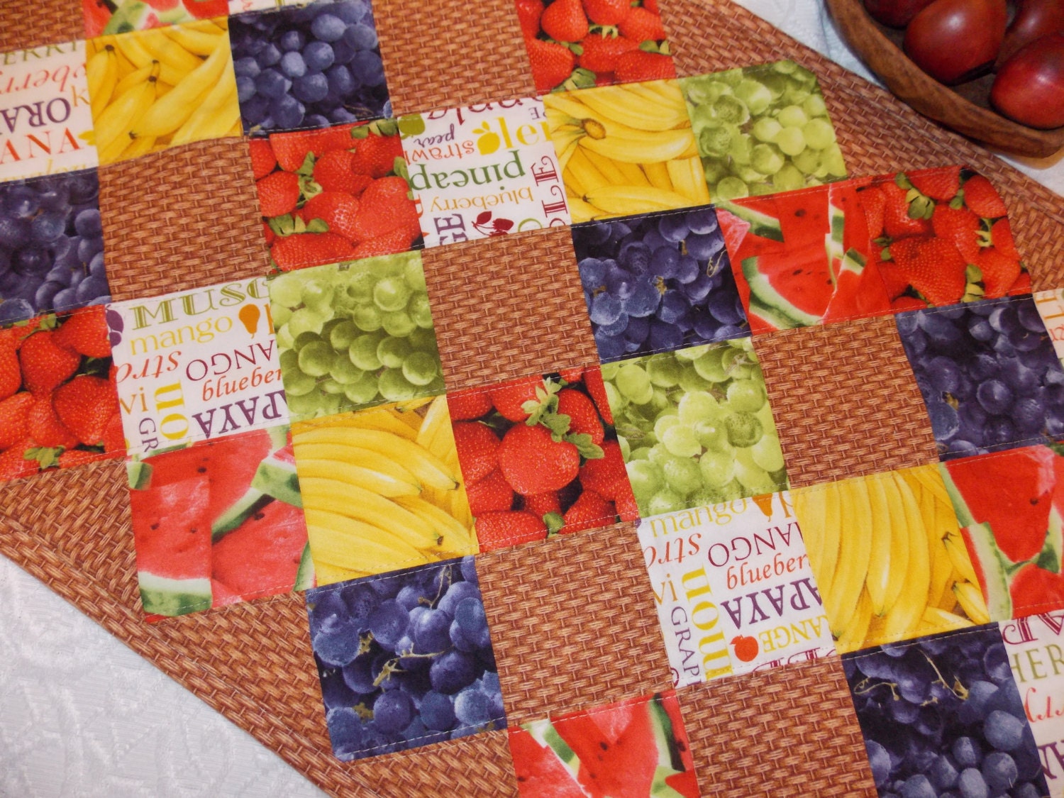 Table Runner Quilt, Table Topper Centerpiece, Fruit Quilt, Grape, Strawberry, Blueberry, Banana, Watermelon, brown, tan, red, green, yellow.